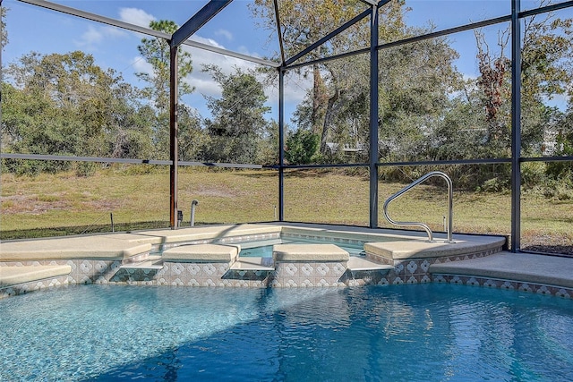 view of pool featuring a lawn, glass enclosure, and an in ground hot tub