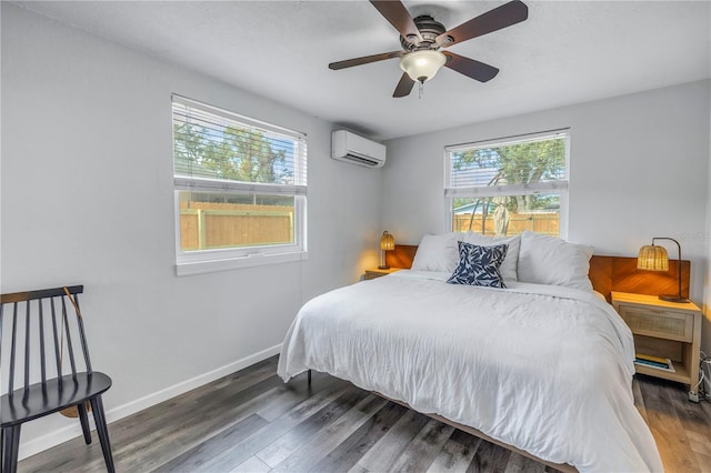 bedroom with dark wood-type flooring, ceiling fan, and a wall mounted air conditioner