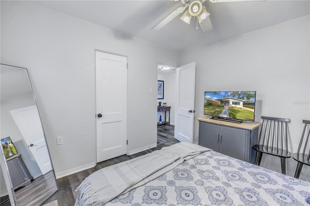 bedroom featuring dark wood-type flooring and ceiling fan