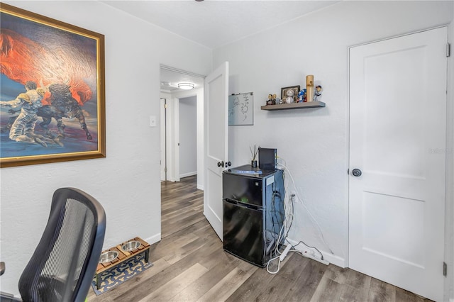 office with hardwood / wood-style flooring