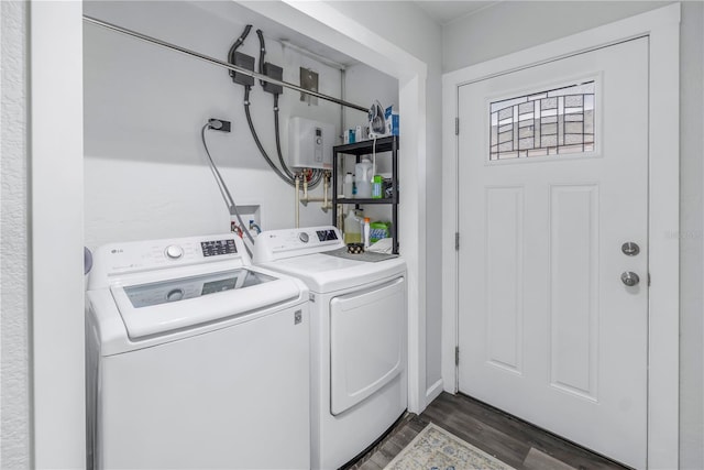 laundry area featuring dark wood-type flooring and washer and dryer