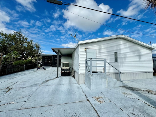 view of side of property with a patio area