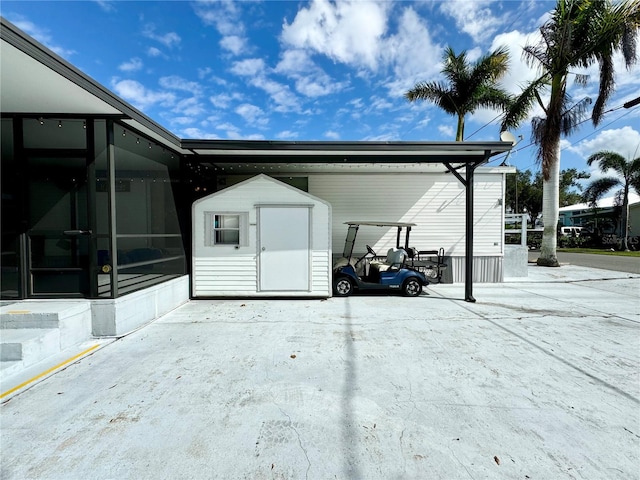 exterior space featuring a storage shed and a sunroom