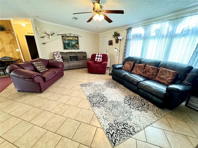 living room with ornamental molding, a textured ceiling, ceiling fan, and light tile patterned floors