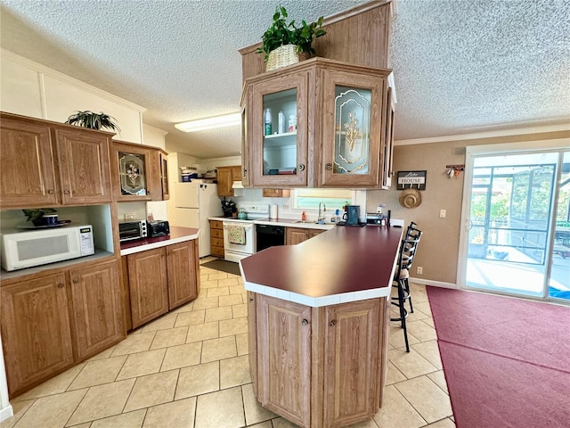 kitchen featuring white appliances, crown molding, light tile patterned floors, and kitchen peninsula