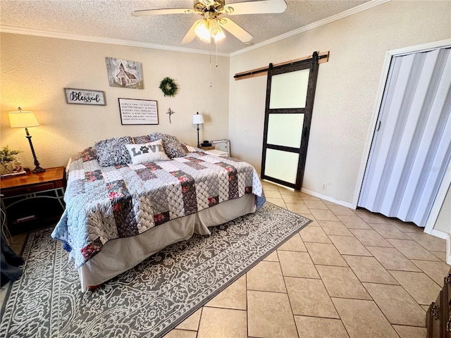 bedroom with light tile patterned flooring, ceiling fan, a textured ceiling, crown molding, and a barn door