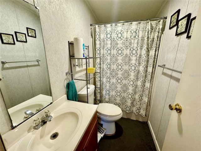 bathroom featuring walk in shower, vanity, a textured ceiling, and toilet