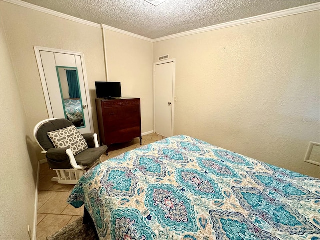 tiled bedroom featuring a textured ceiling and crown molding