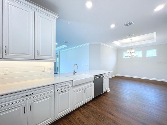 kitchen featuring dishwasher, white cabinets, sink, crown molding, and dark hardwood / wood-style flooring