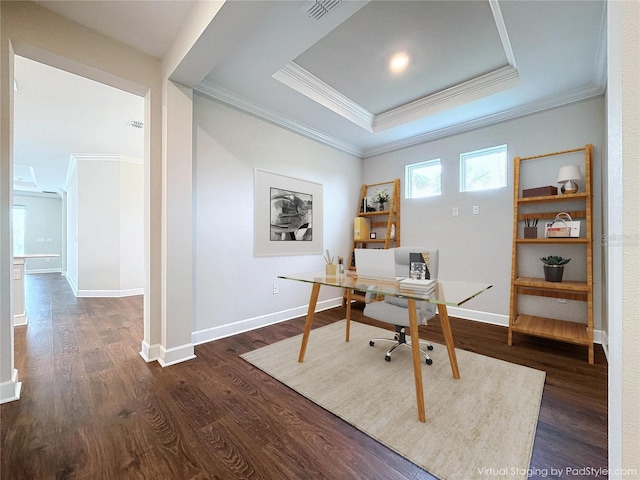 office area with a raised ceiling, crown molding, and dark hardwood / wood-style flooring