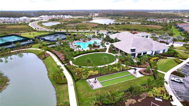 birds eye view of property with a water view