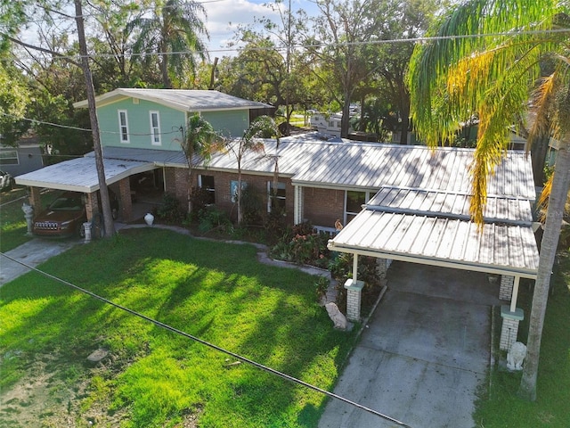 view of front facade with a carport and a front yard