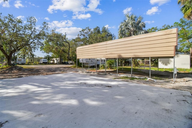 view of vehicle parking with a carport