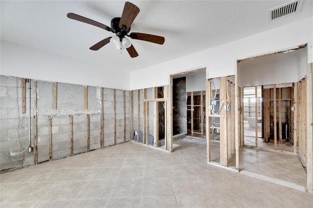 interior space with ceiling fan