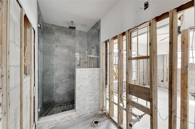 bathroom with a shower with shower door