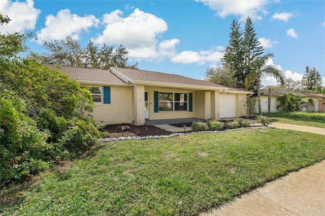 single story home with a garage and a front lawn