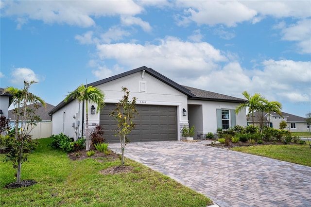 ranch-style house with a front lawn and a garage