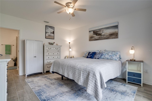 bedroom with light wood-type flooring and ceiling fan