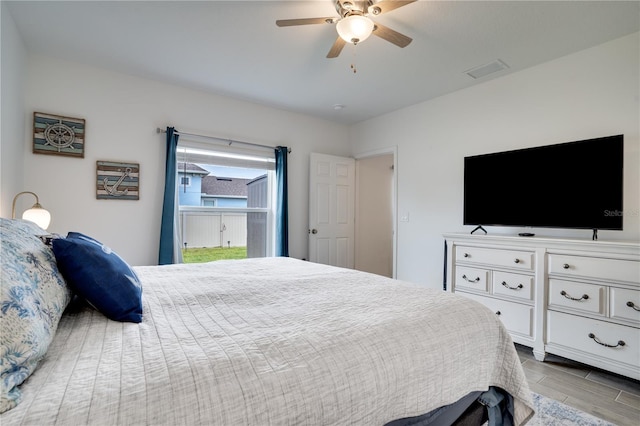 bedroom featuring ceiling fan and light hardwood / wood-style floors