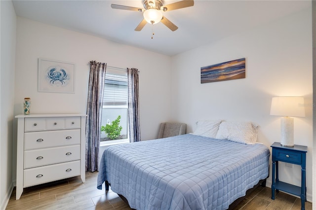 bedroom with hardwood / wood-style flooring and ceiling fan