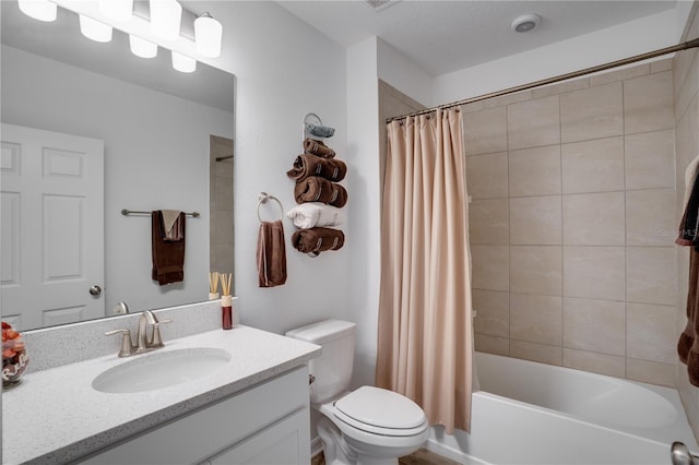 full bathroom with toilet, shower / tub combo with curtain, and vanity