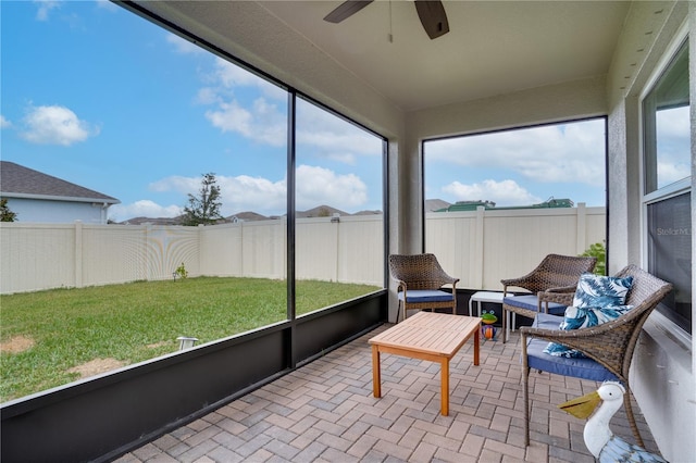 sunroom / solarium with ceiling fan