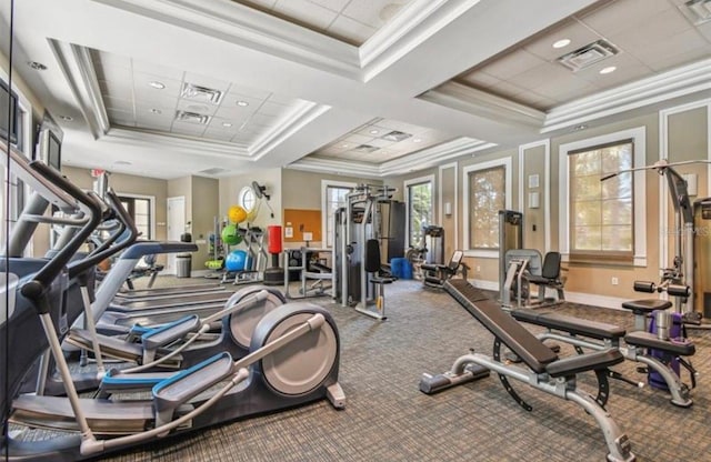 exercise room featuring ornamental molding, carpet, and coffered ceiling