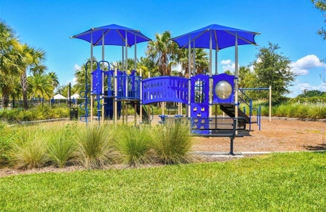 view of playground featuring a lawn