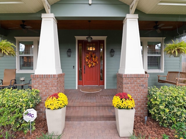 property entrance featuring a porch and a ceiling fan