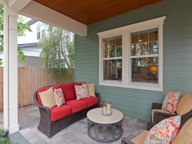 view of patio / terrace featuring fence and an outdoor hangout area