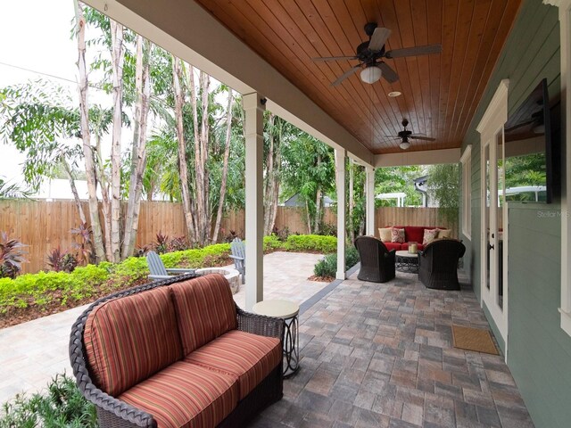 view of patio / terrace with outdoor lounge area, ceiling fan, and a fenced backyard