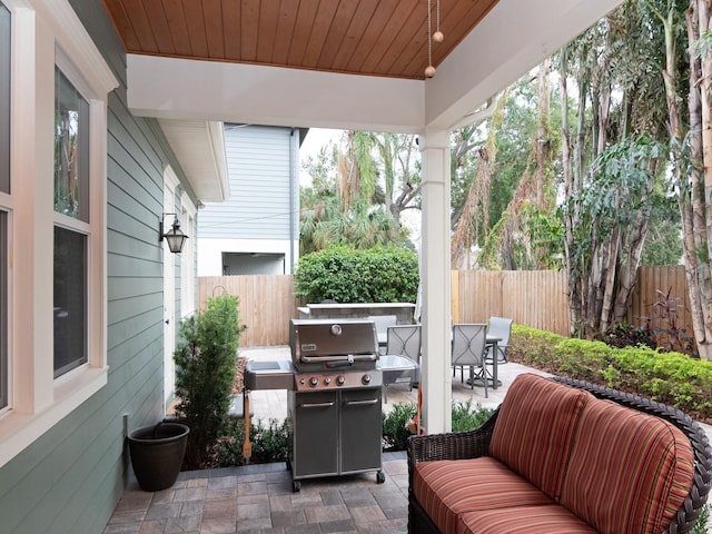 view of patio / terrace featuring an outdoor hangout area, grilling area, and fence private yard