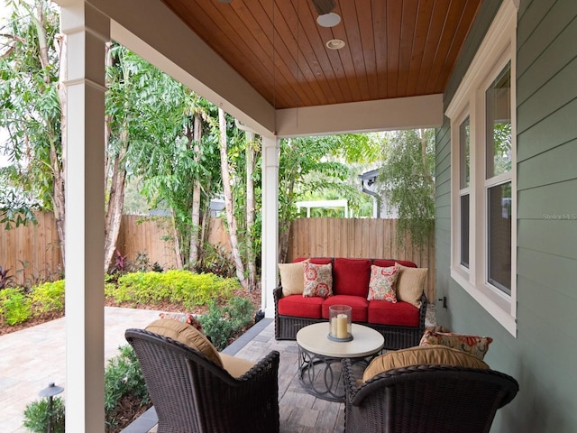 view of patio / terrace featuring fence and outdoor lounge area