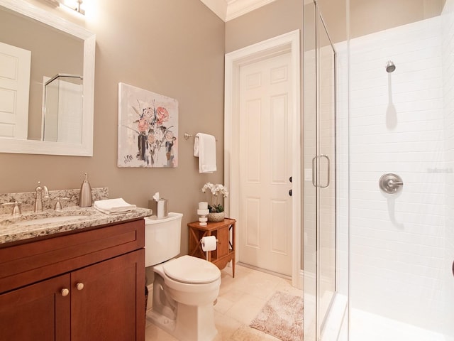 full bathroom with toilet, a stall shower, and vanity