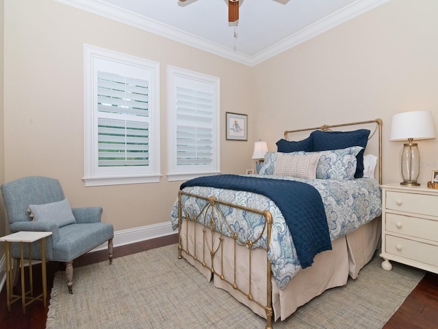 bedroom featuring baseboards, ornamental molding, ceiling fan, and wood finished floors