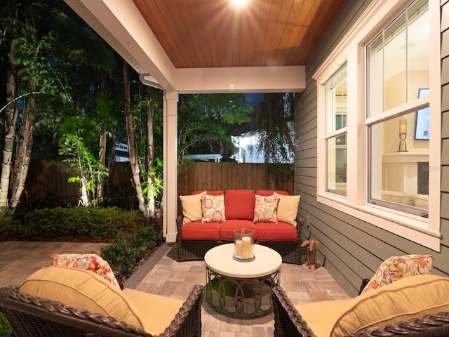 view of patio with outdoor lounge area and fence