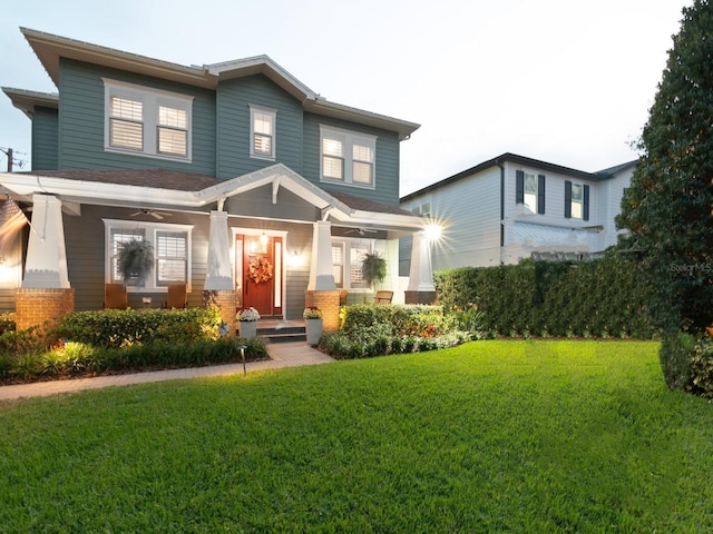 view of front of home featuring a porch and a front yard