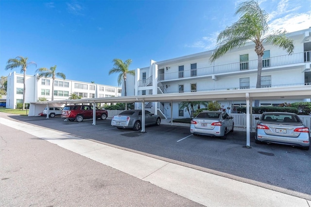 view of vehicle parking featuring a carport