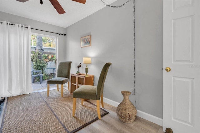 sitting room featuring hardwood / wood-style flooring and ceiling fan