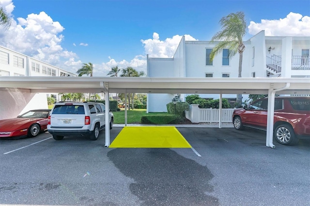 view of parking / parking lot with a carport