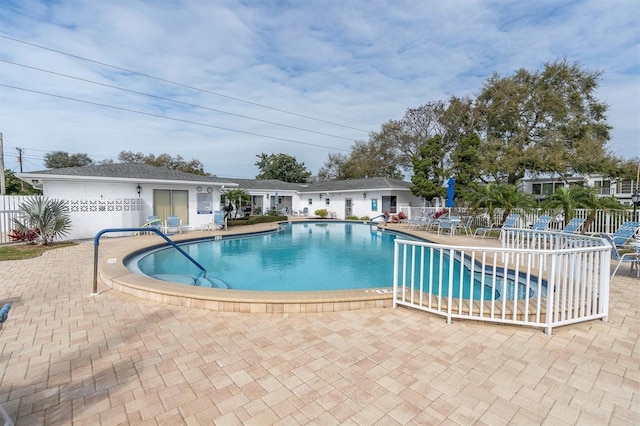 view of swimming pool with a patio area