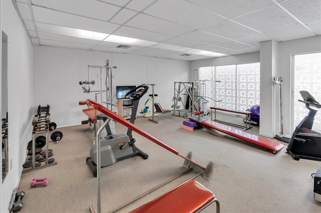 workout area featuring a drop ceiling