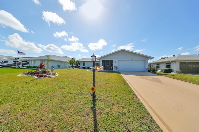 ranch-style house with a garage and a front lawn