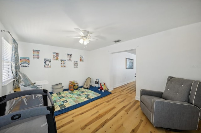 bedroom with hardwood / wood-style flooring and ceiling fan