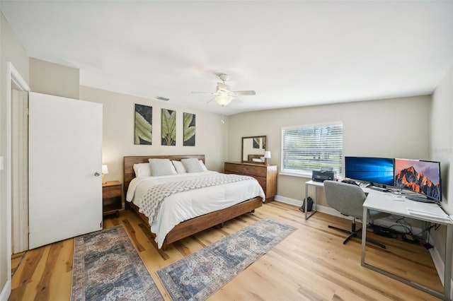 bedroom featuring light hardwood / wood-style floors and ceiling fan