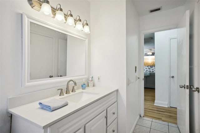 bathroom featuring vanity and hardwood / wood-style flooring