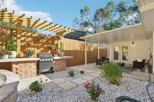 view of patio featuring area for grilling and french doors