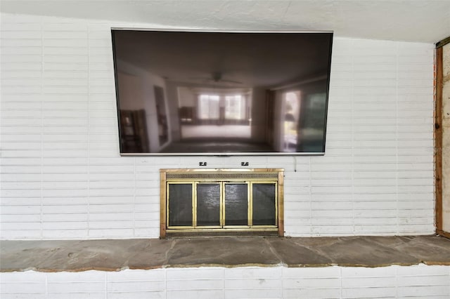 unfurnished living room with vaulted ceiling