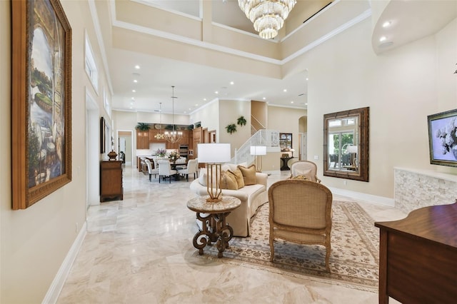 living room with a high ceiling and a notable chandelier