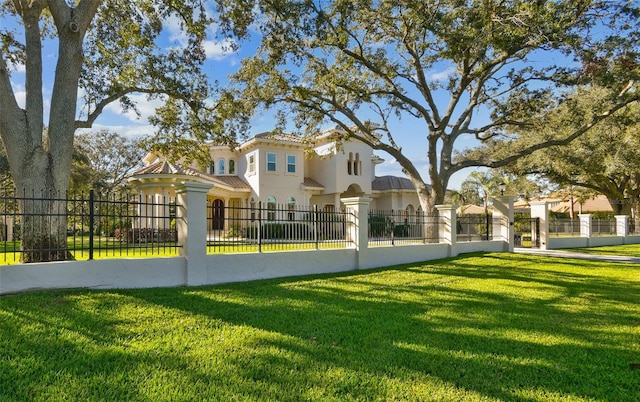 view of home's community featuring a lawn